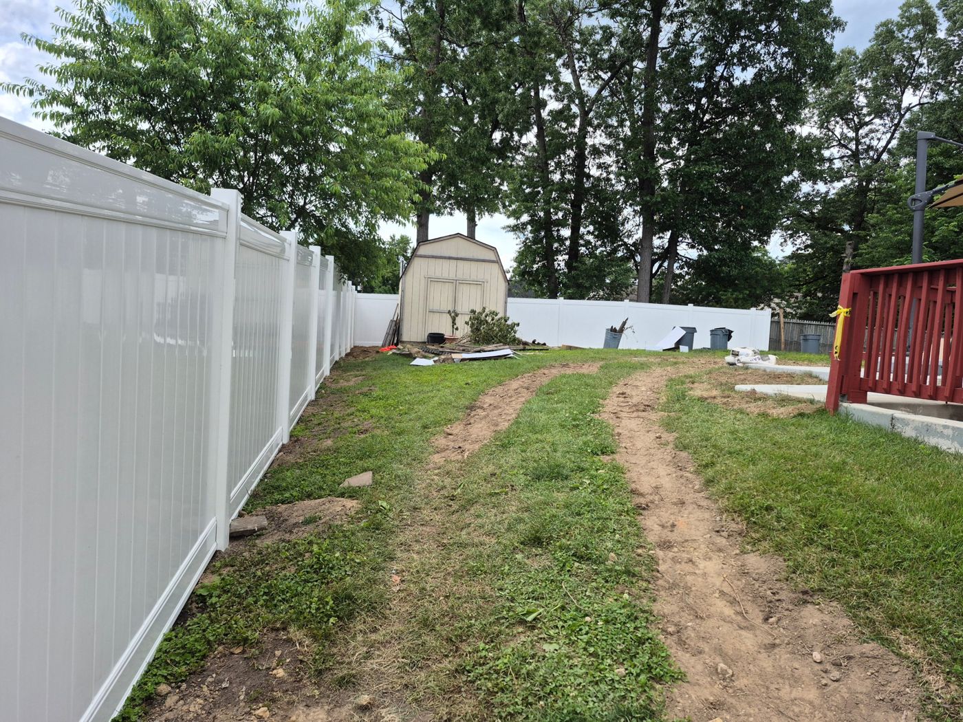Backyard vinyl fence install