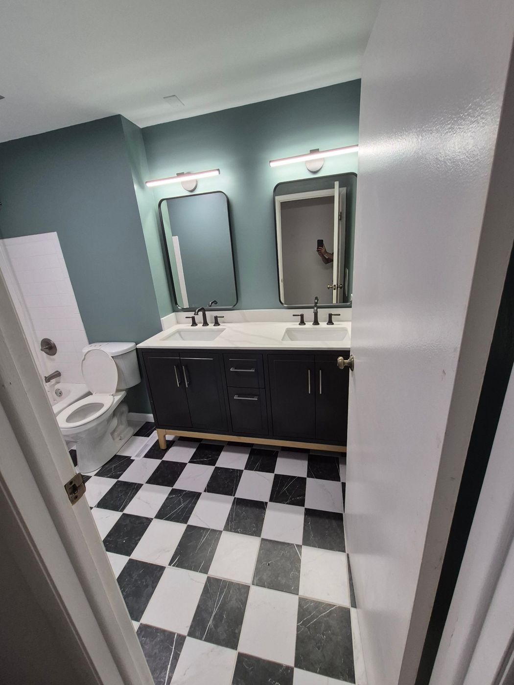 Double-vanity bathroom with checkerboard tile