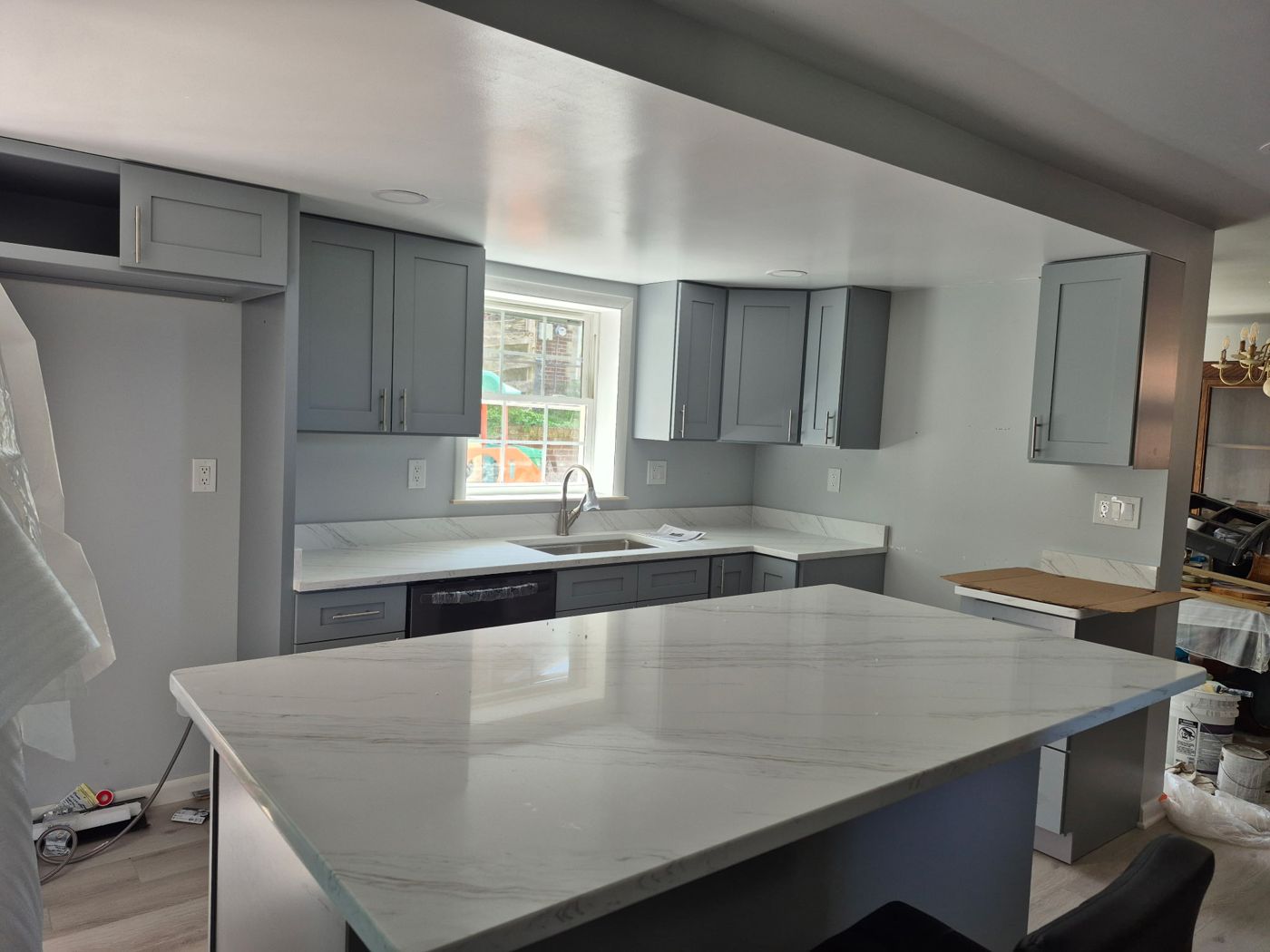 Gray shaker kitchen with marble-look quartz island