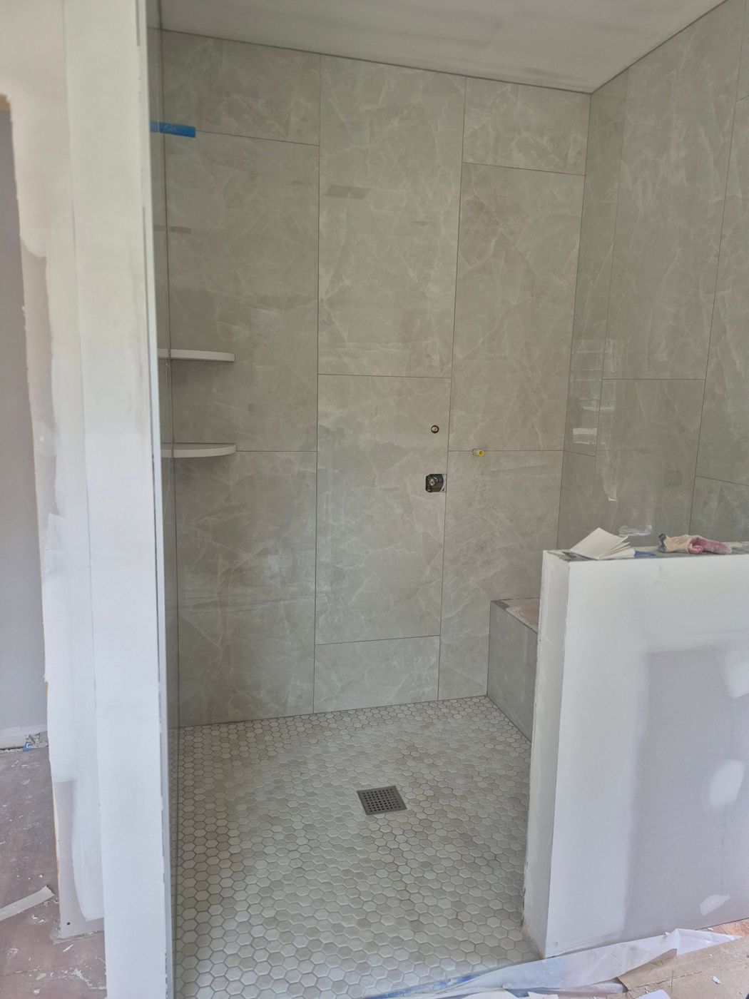 Large-format tile shower with bench